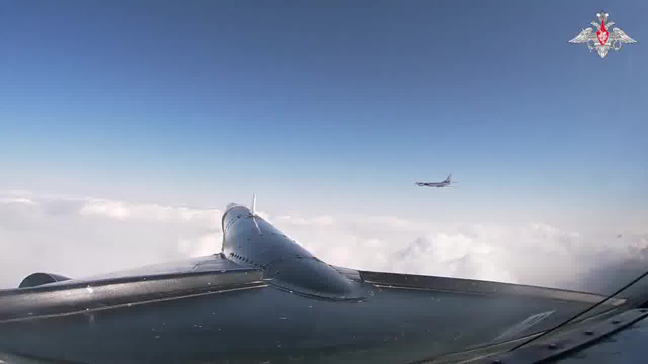 Russian MOD video of Two Tu-95MS long-range bombers flight over the Sea of Okhotsk and Sea of Japan(East Sea).The flight duration exceeded 8 hours. Su-35S and Su-30SM aircraft of the Russian Aerospace Forces escorted the bombers